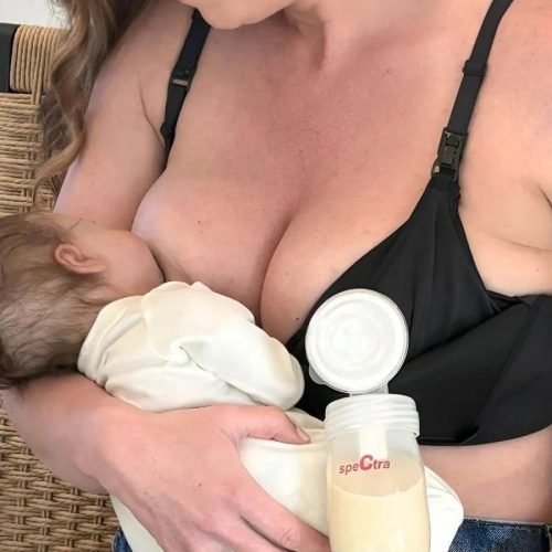 imgi_143_SuperMom_Silhouette_Nursing_Pumping_Seamless_Bra_-_Fixed_Pads_-_Simple_Wishes_-_Midnight_-_front_view_breastfeeding_while_supporting_a_single_breast_pump